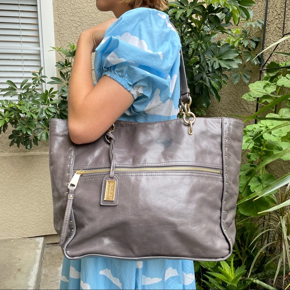 Gray Badgley Mischka distressed leather bag with gold hardware